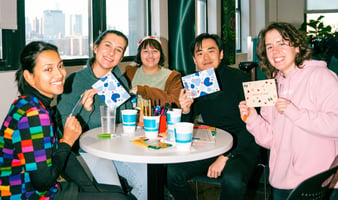 A group of people writing letters