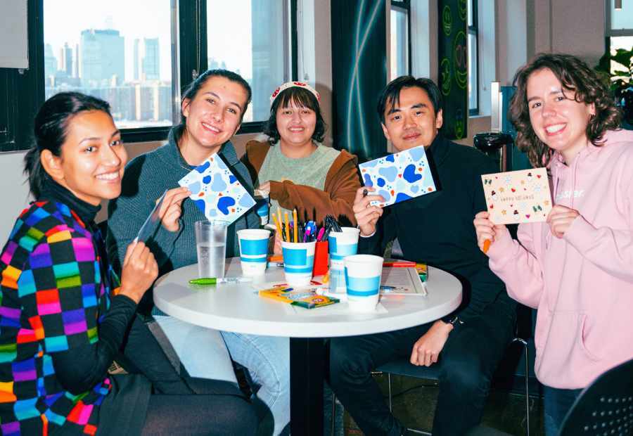 Participants holding up handwritten cards