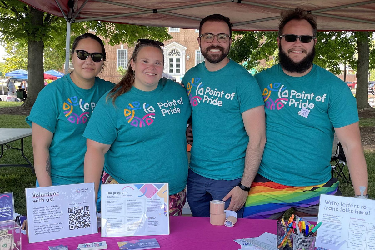 Point of Pride staff and volunteers at a LGBTQ+ Pride event